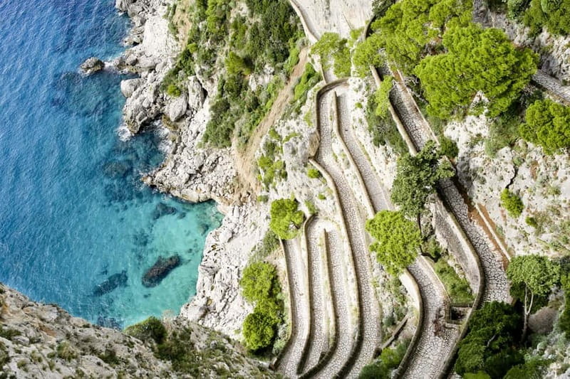 From Naples: Complete Capri Guided Boat and Bus Tour - Augustus Gardens and the Faraglioni rocks: the stop that makes photos make sense