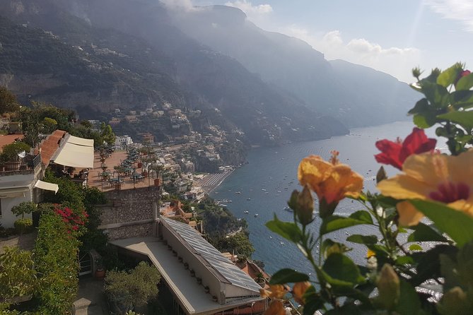 Positano, Sorrento and Pompeii Guided Tour from Naples - Positano in one hour: stair streets, beach access, and fashion buys